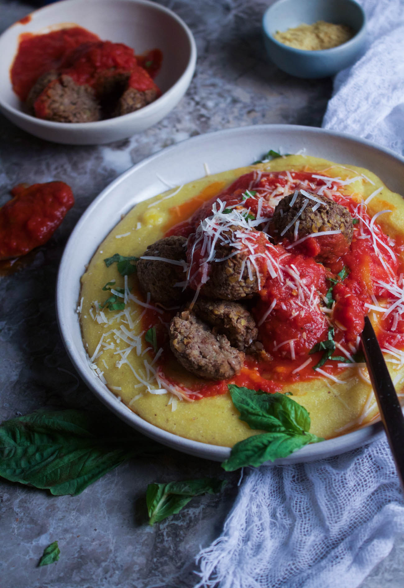 4 Ingredient Baked Lentil Meatballs with Cheesy Polenta and Tomato Sauce 