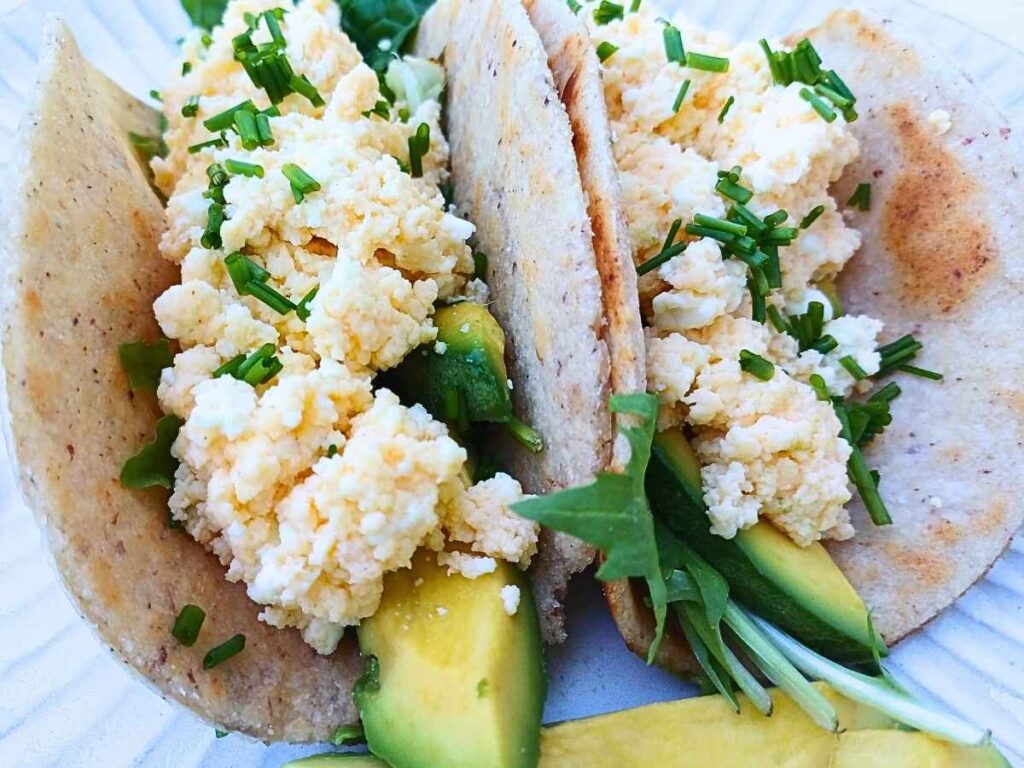 Cottage cheese scrambled eggs inside a tortilla