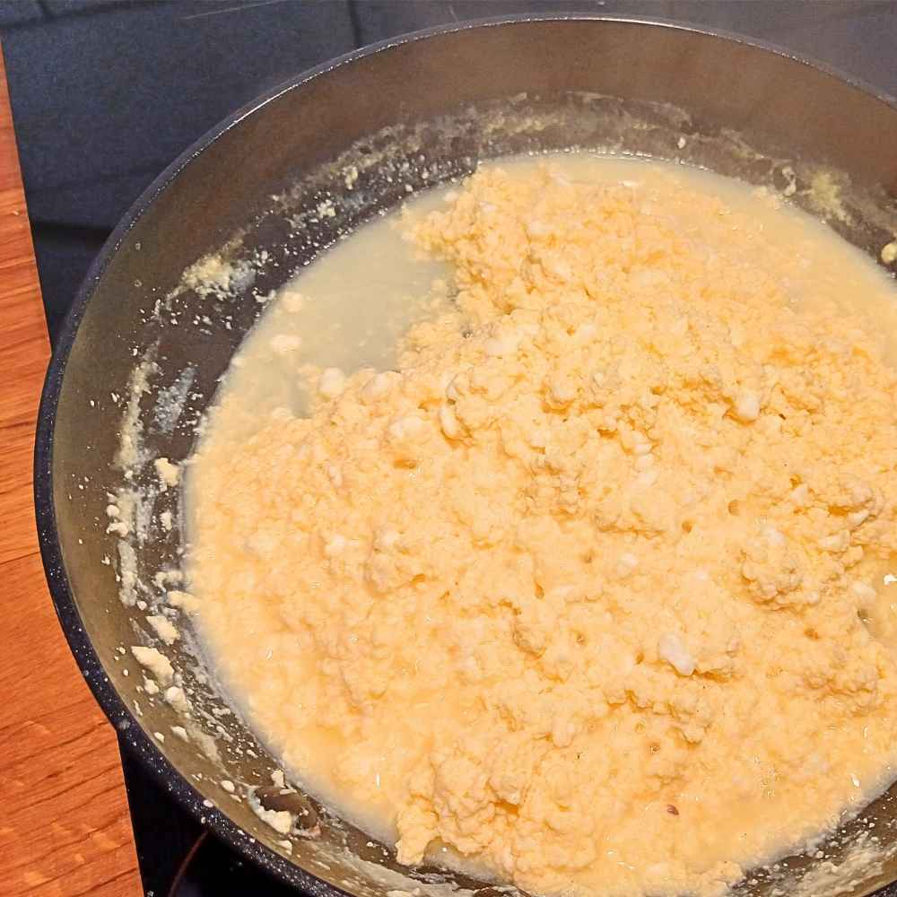 Liquid from cottage cheese and scrambled eggs while cooking