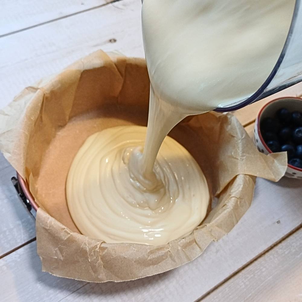 Pouring the cottage cheese batter into cake pan