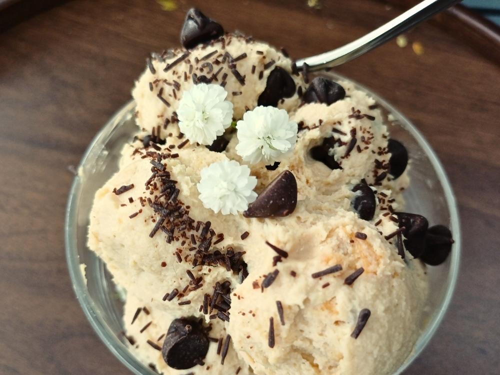 Cottage cheese cookie dough decorated with chcolate chips and small white flowers