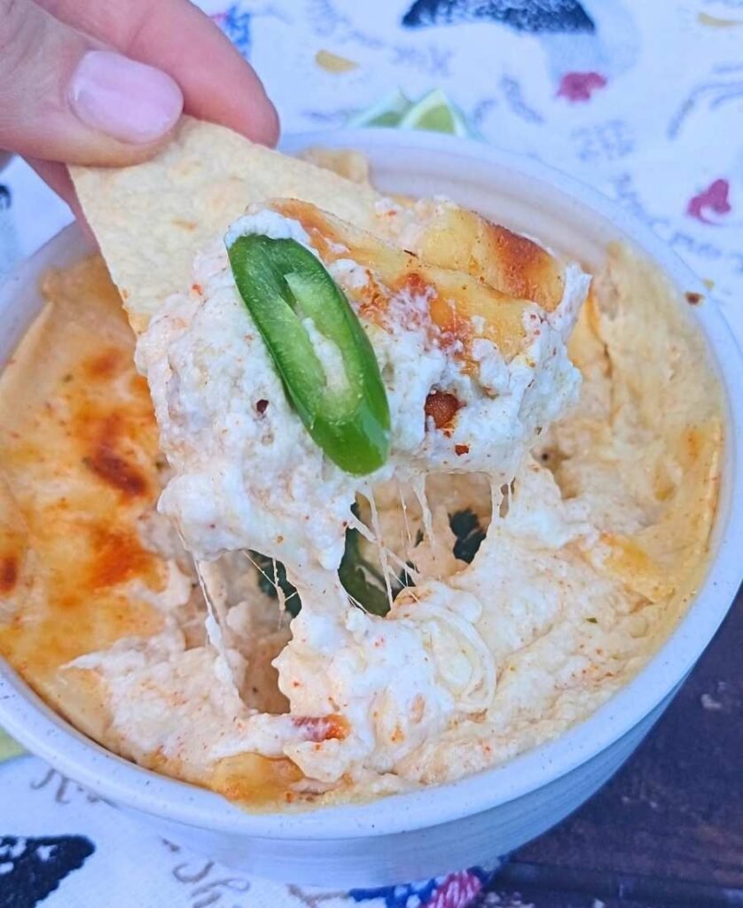 Creamy cottage cheese queso on a tortilla chip