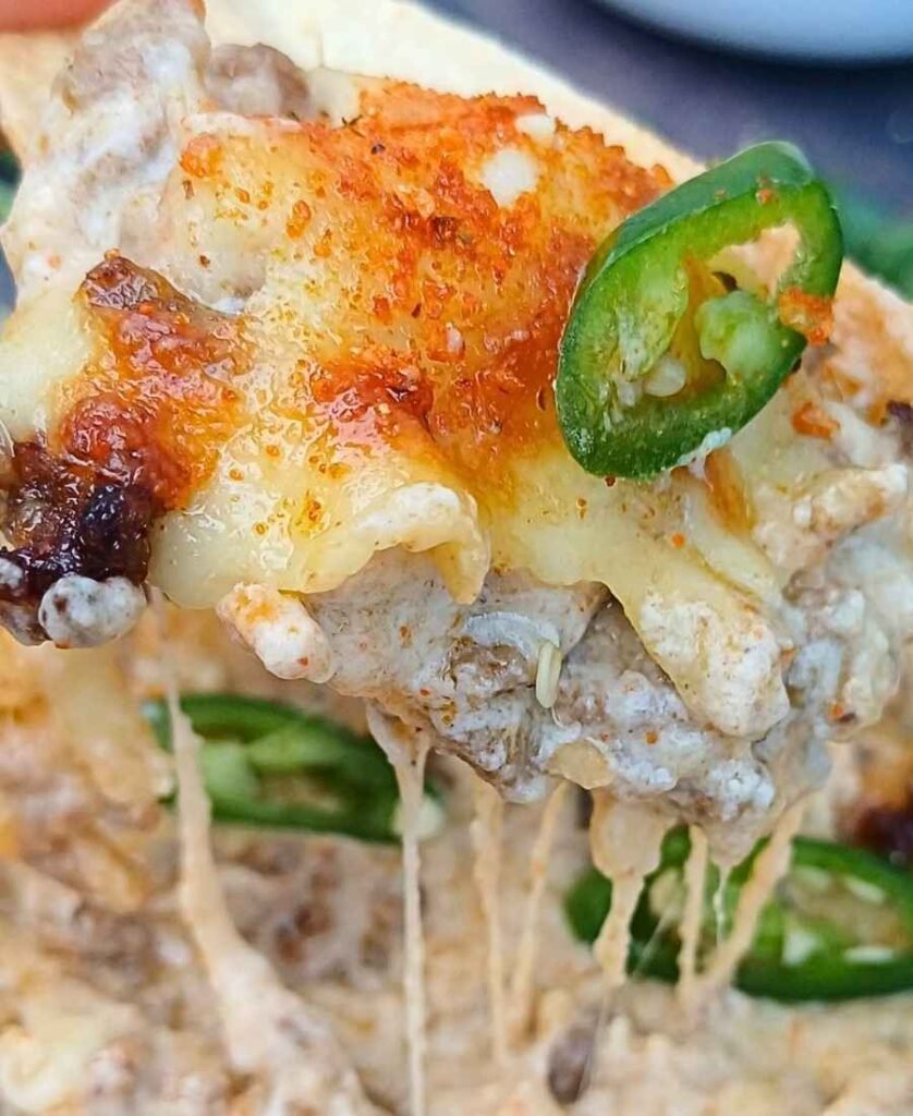 Creamy cottage cheese queso on a tortilla chip