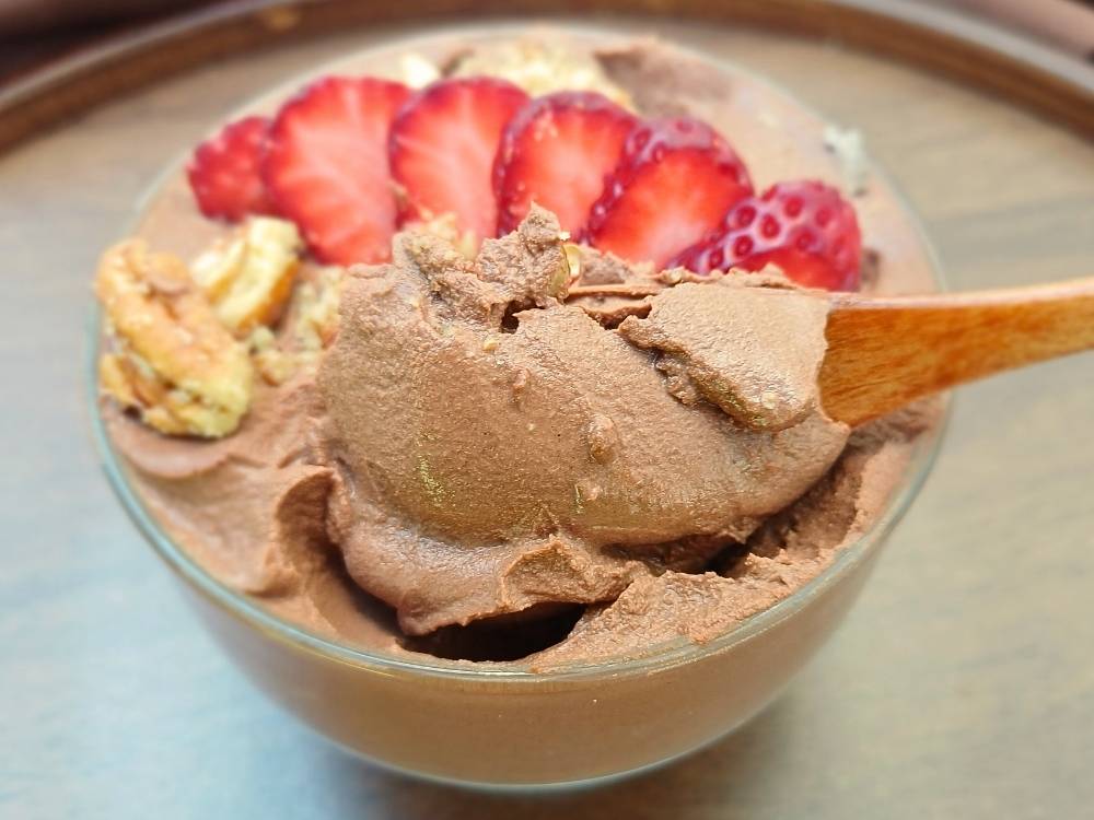 Chocolate cottage cheese mousse topped with strawberries and walnuts.