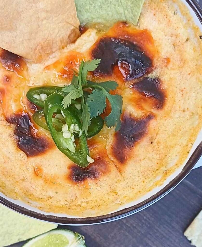 Golden cheesy crust on a cottage cheese queso dip