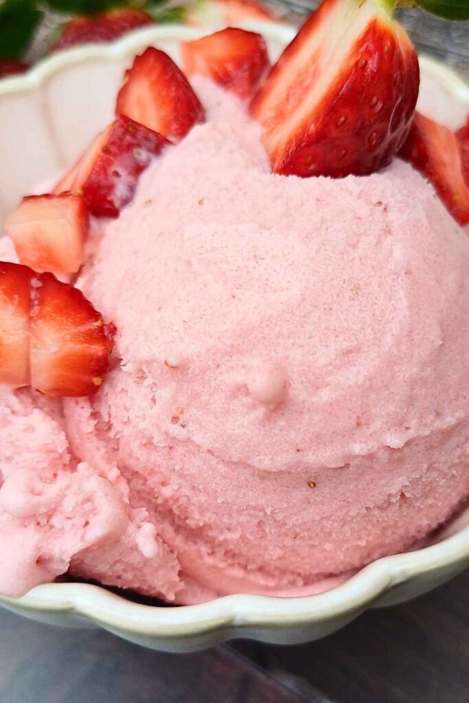 Ninja creami strawberry ice cream in a ceramic cup