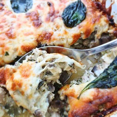 Close up of the inside of the keto chicken mushroom casserole spooned out of a baking dish.