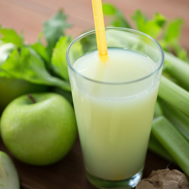 green juice with celery and green apple in a glass