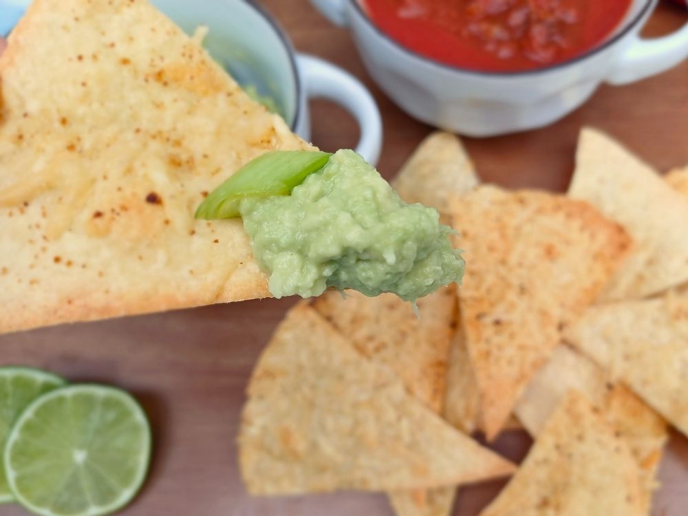 Keto chip with homemade guacamole on it