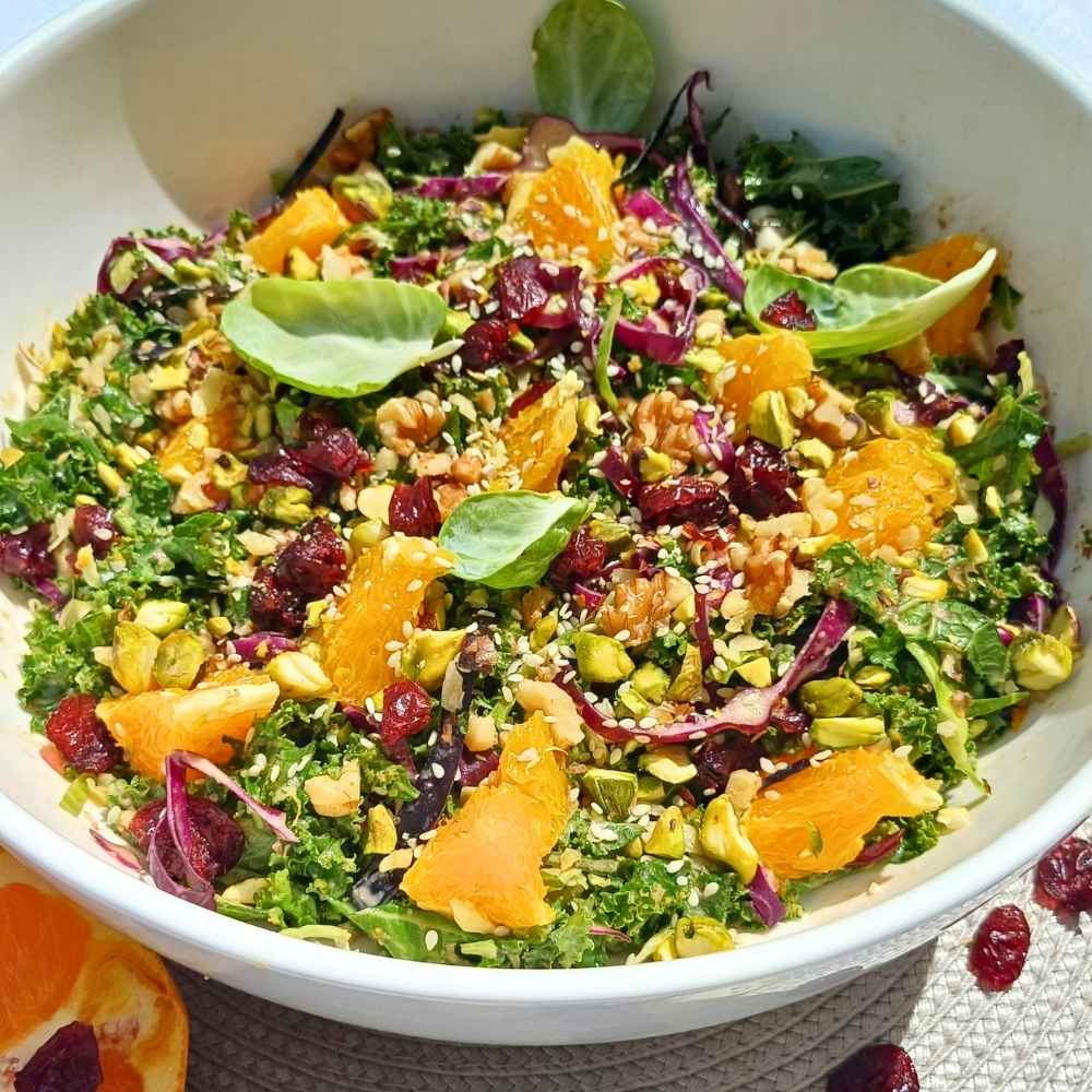Bowl of kale and Brussels sprout salad with oranges