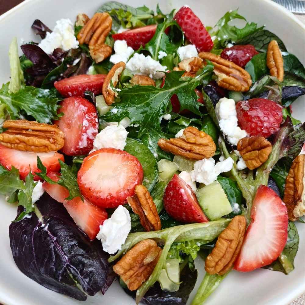 Strawberry feta salad with honey lemon dressing and pecan nuts