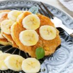 banana cottage cheese pancakes with slices of banana on top