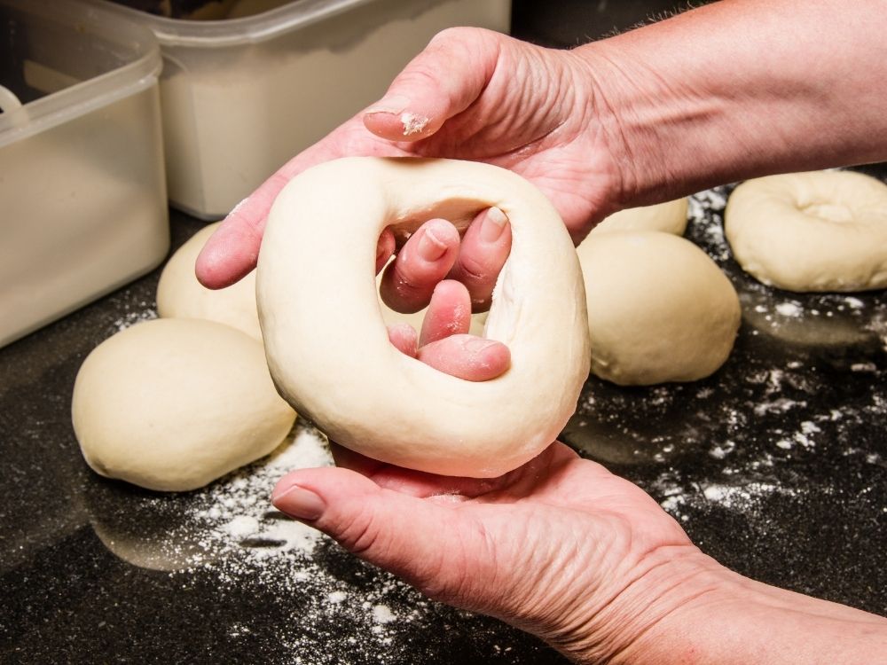 Shaping the bagels with hands