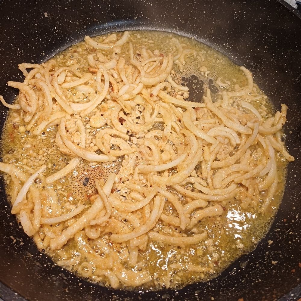Frying the sliced onions