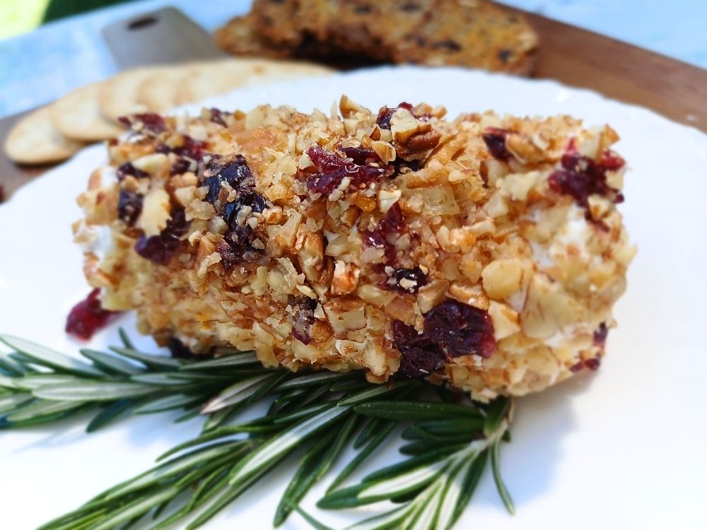 Goat cheese log rolled in pecans and dried cranberries.