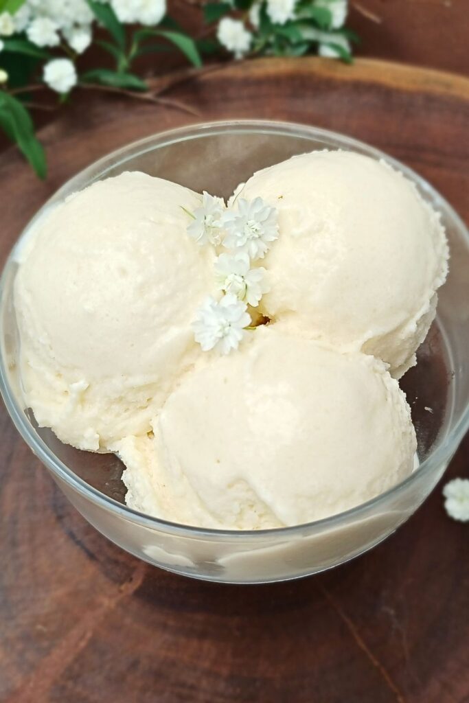 Close up of a creamy vanilla ice cream made at home in a glass serving bowl