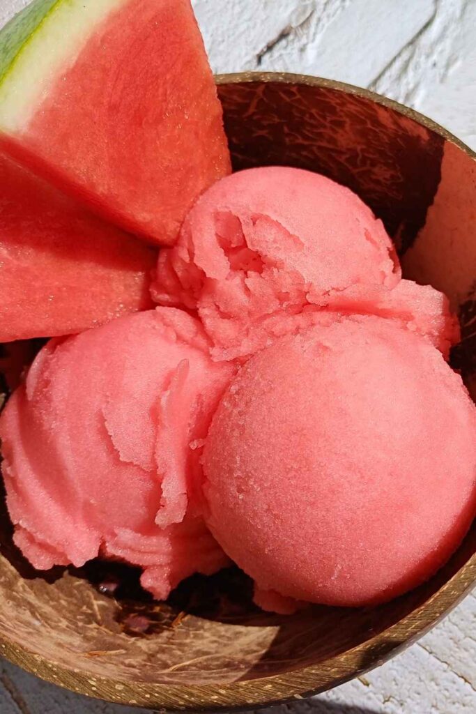 Watermelon sorbet scoops with watemelon pieces