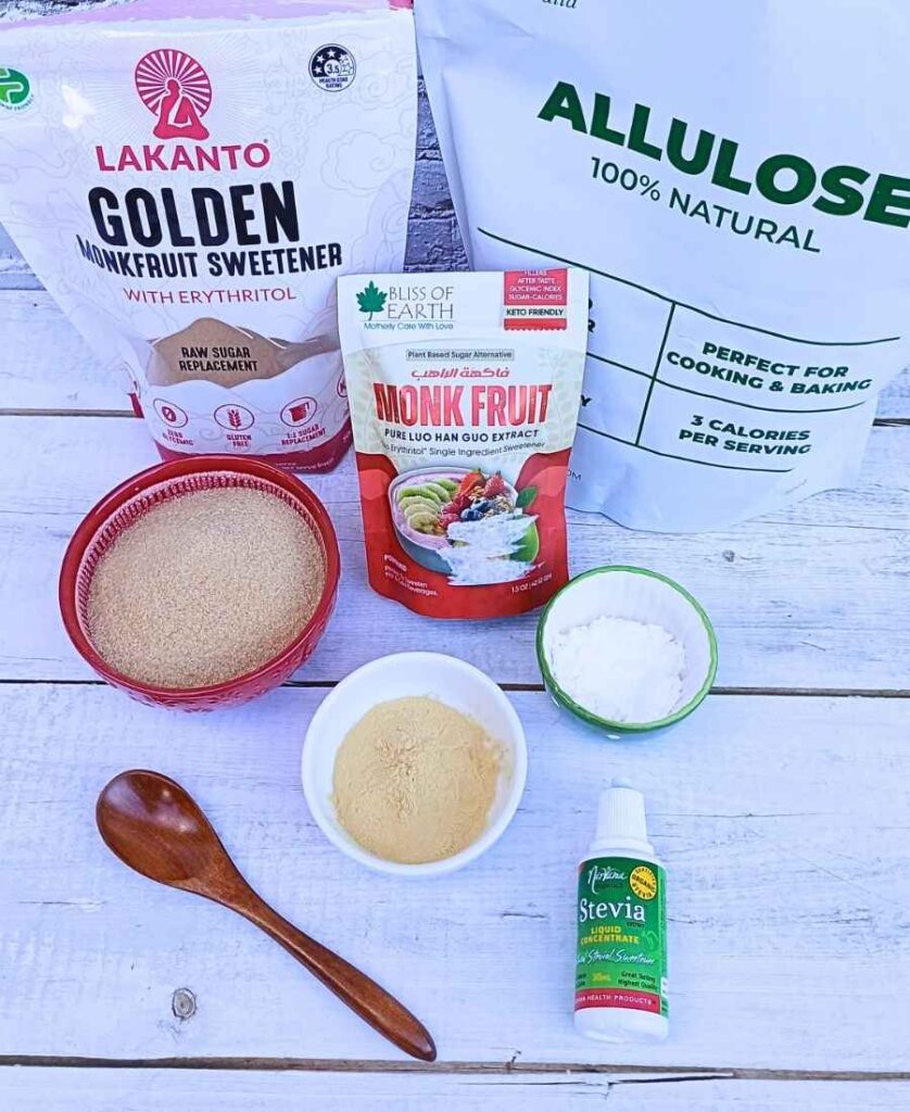 Allulose, stevia and monk fruit sweeteners in bowls and packets