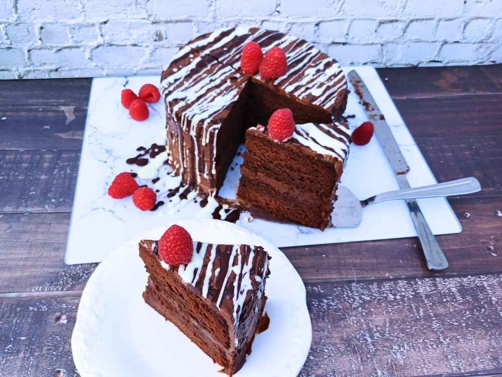 almond flour chocolate cake sliced with raspberries