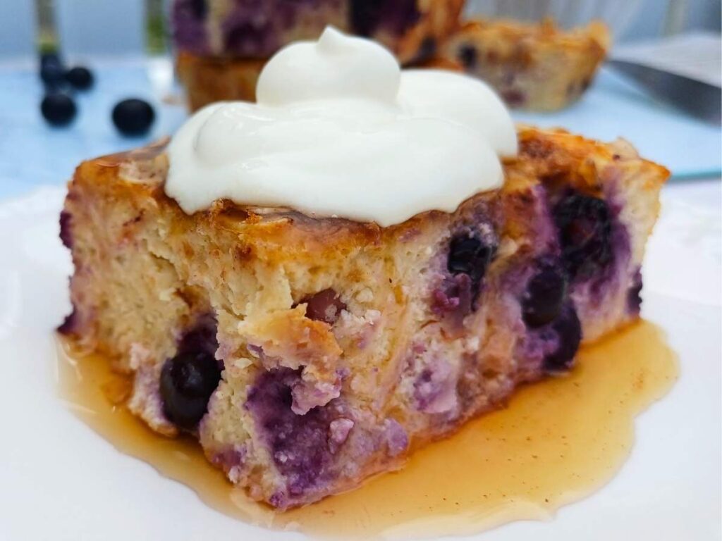 A slice of breakfast bake with yogurt on top