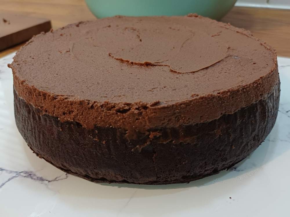 chocolate cake with a layer of frosting on top