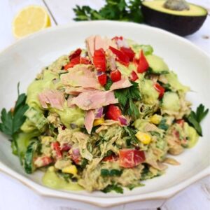 A bowl of healthy tuna salad with avocado dressing