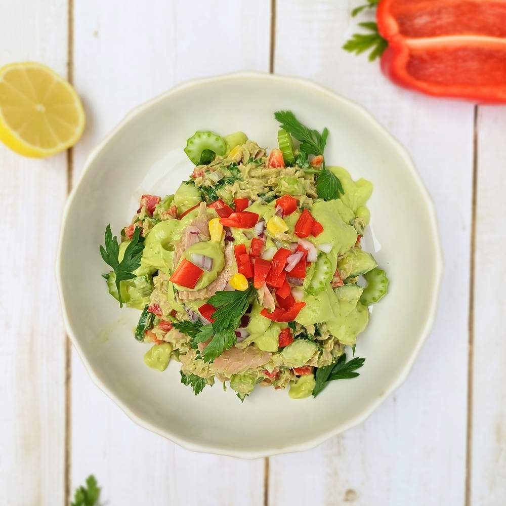 Top down view of a healthy tuna salad in a white bowl