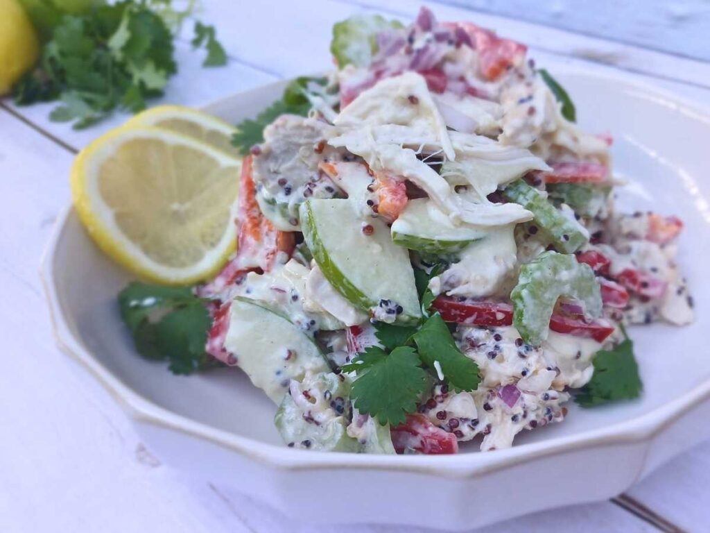 High protein chicken salad with yogurt dressing, quinoa and crunchy vegetables