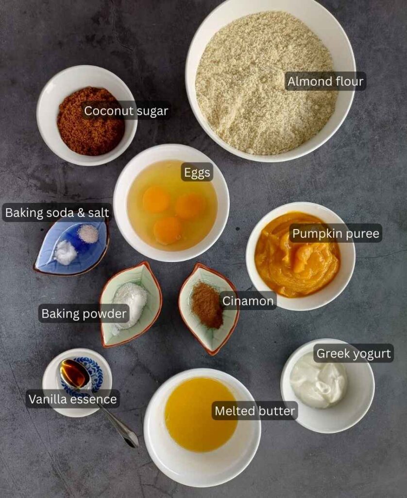 Ingredients for pumpkin muffins with almond flour in bowls