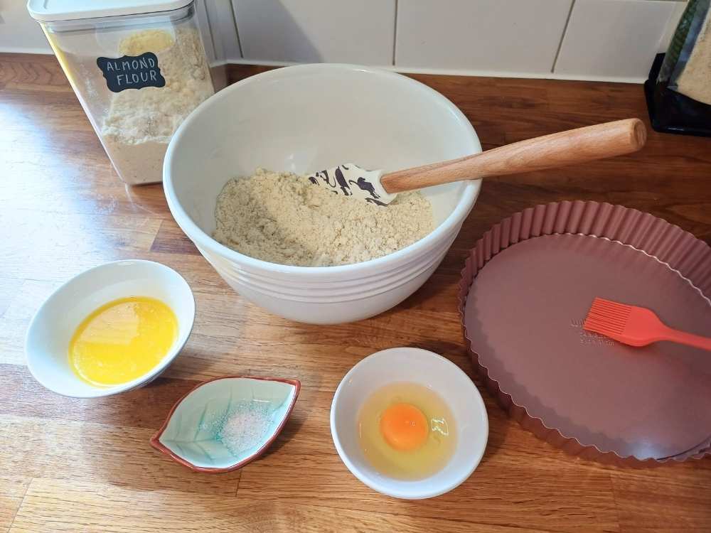 Ingredients for almond flour pie crust in bowls