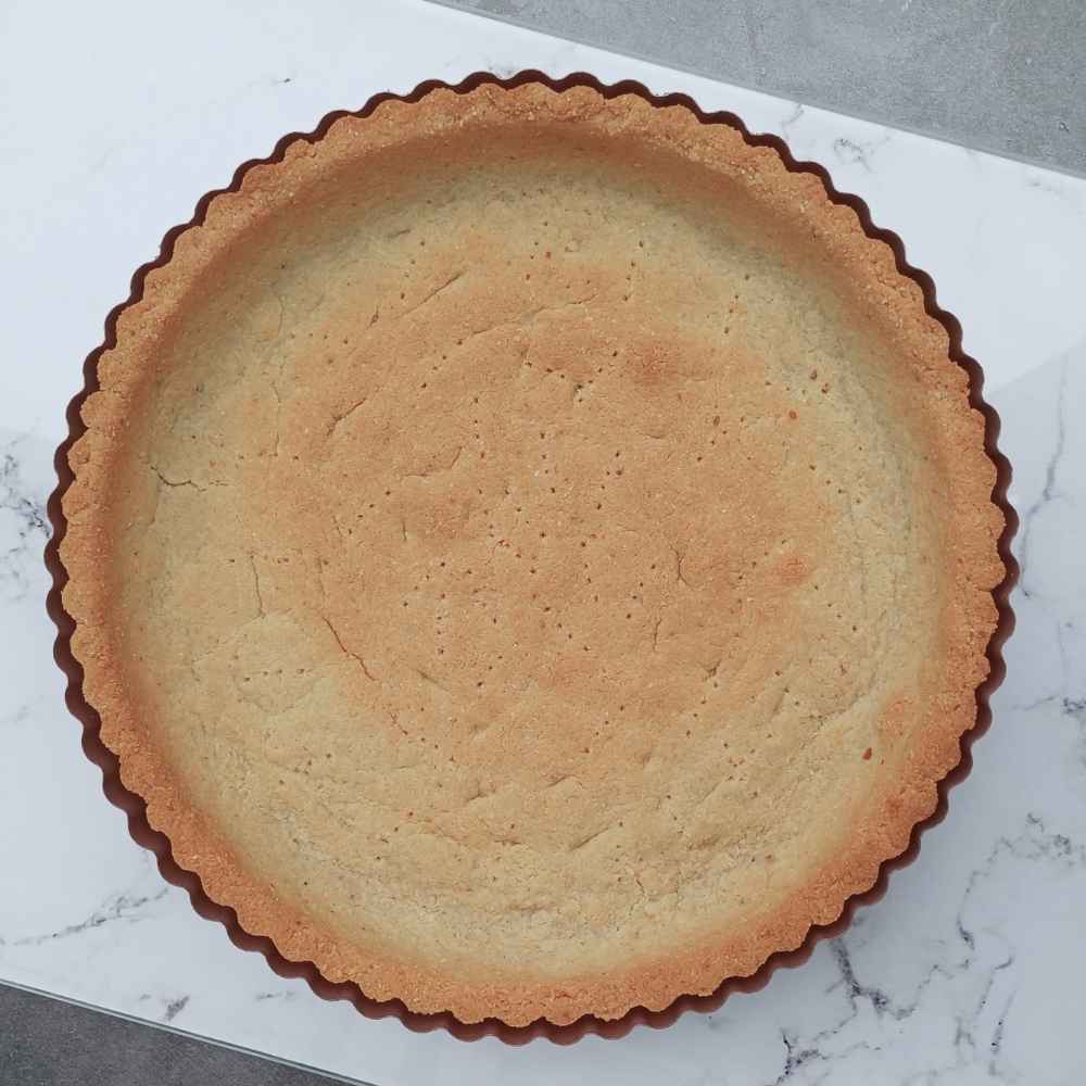 almond flour pie crust baked on marble board