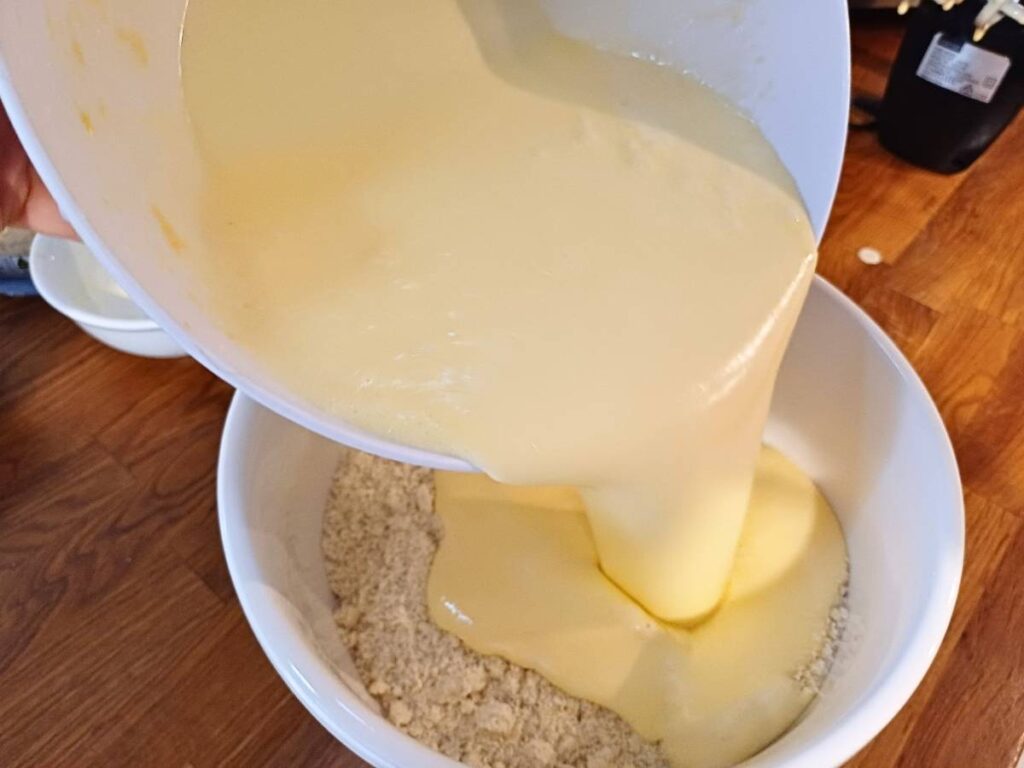 Eggs and sweetener poured into almond flour for the muffin batter