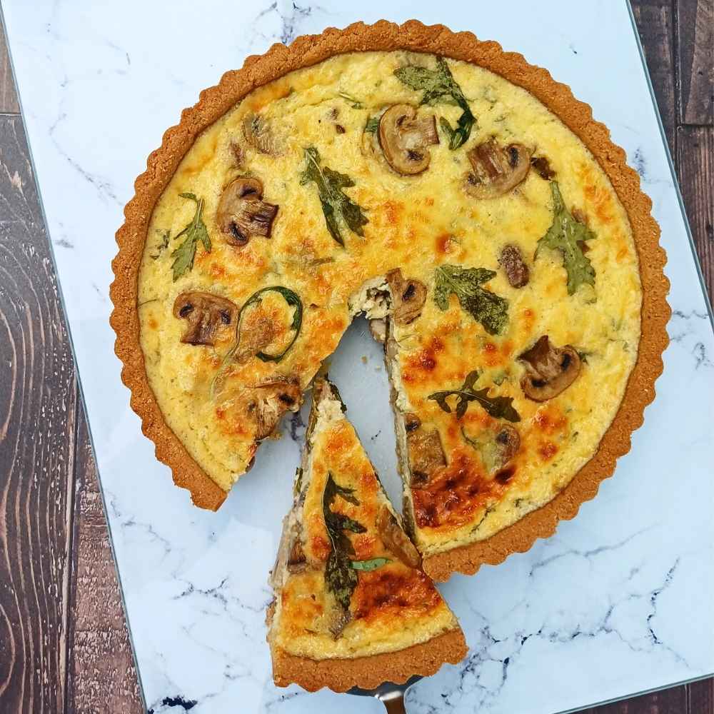 An almond flour and cottage cheese quiche with a slice cut out