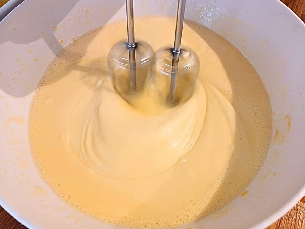 Eggs being whisked with allulose for almond flour muffin batter