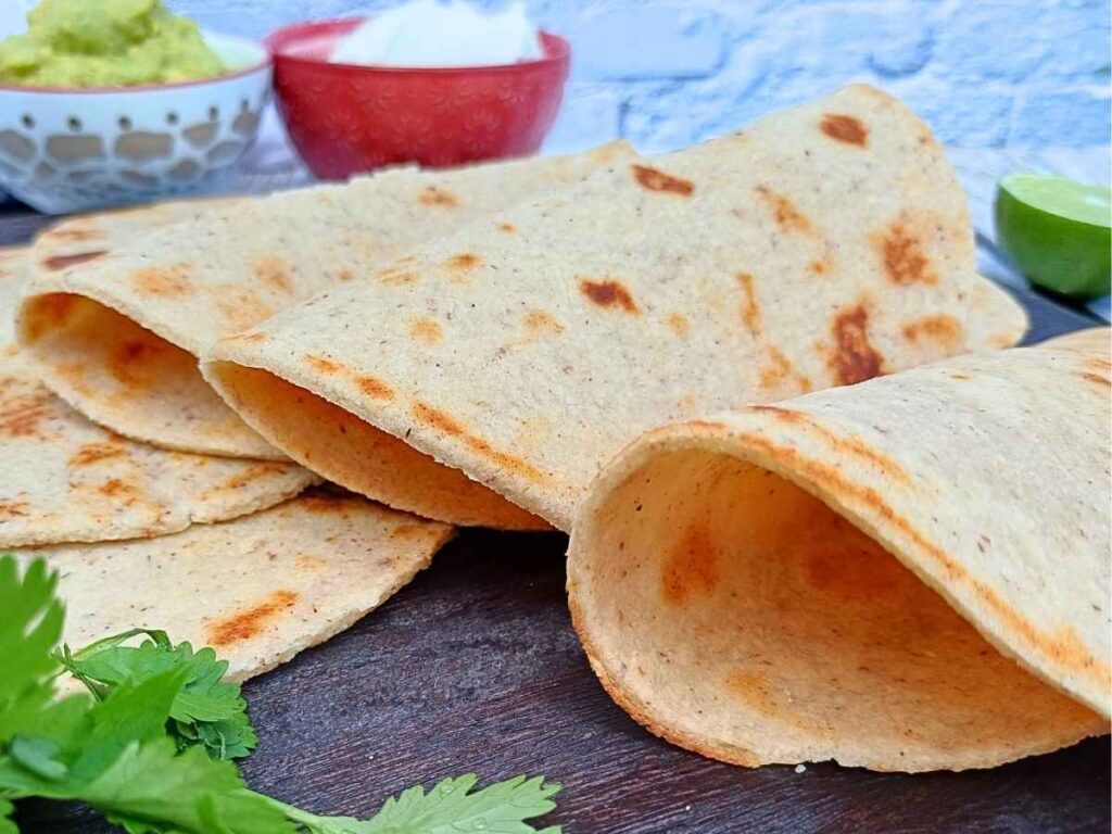 almond flour torillas folded over on a board