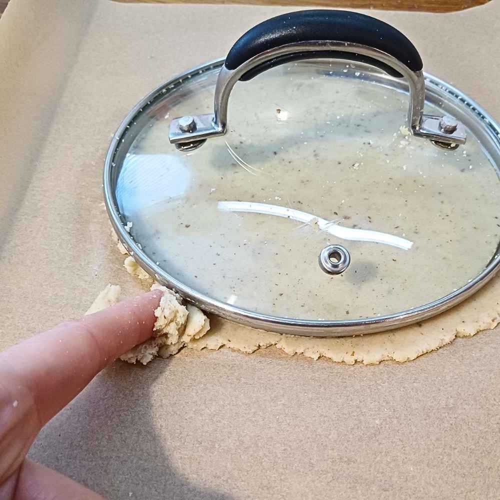 cutting tortilla with a pot lid