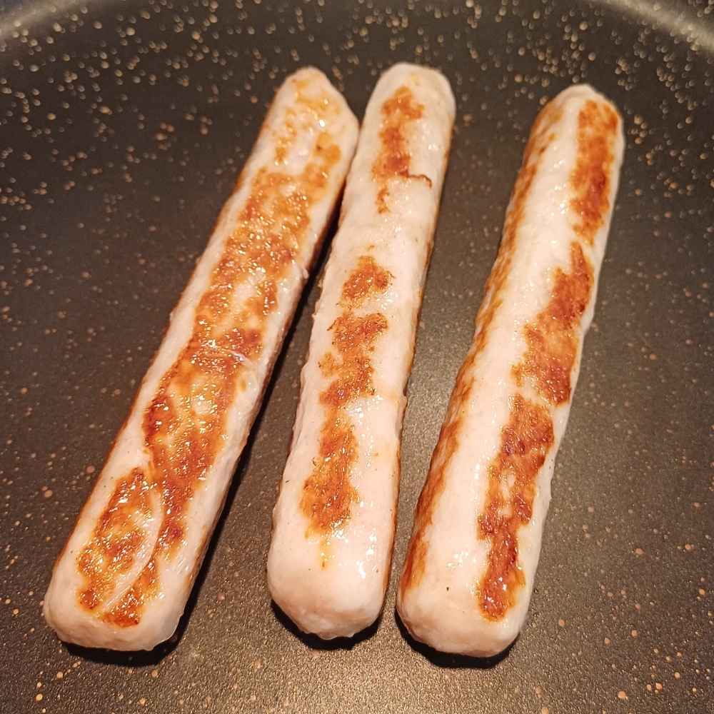 Chicken sausages on the skillet cooked
