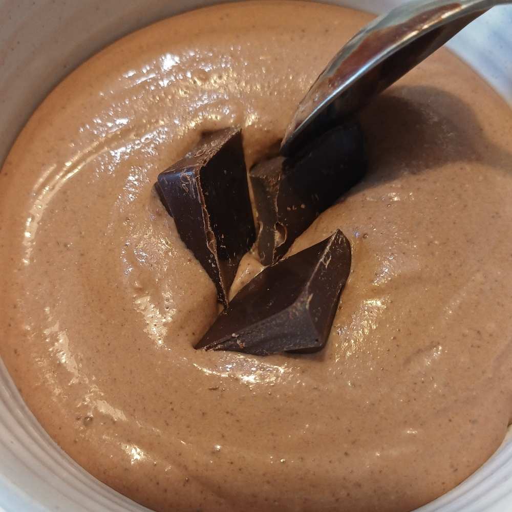 adding chocolate to the lava mug cake