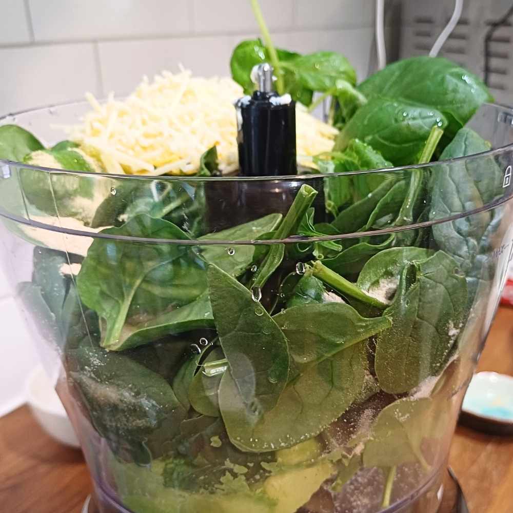 Ingredients for pesto pasta sauce in a blender