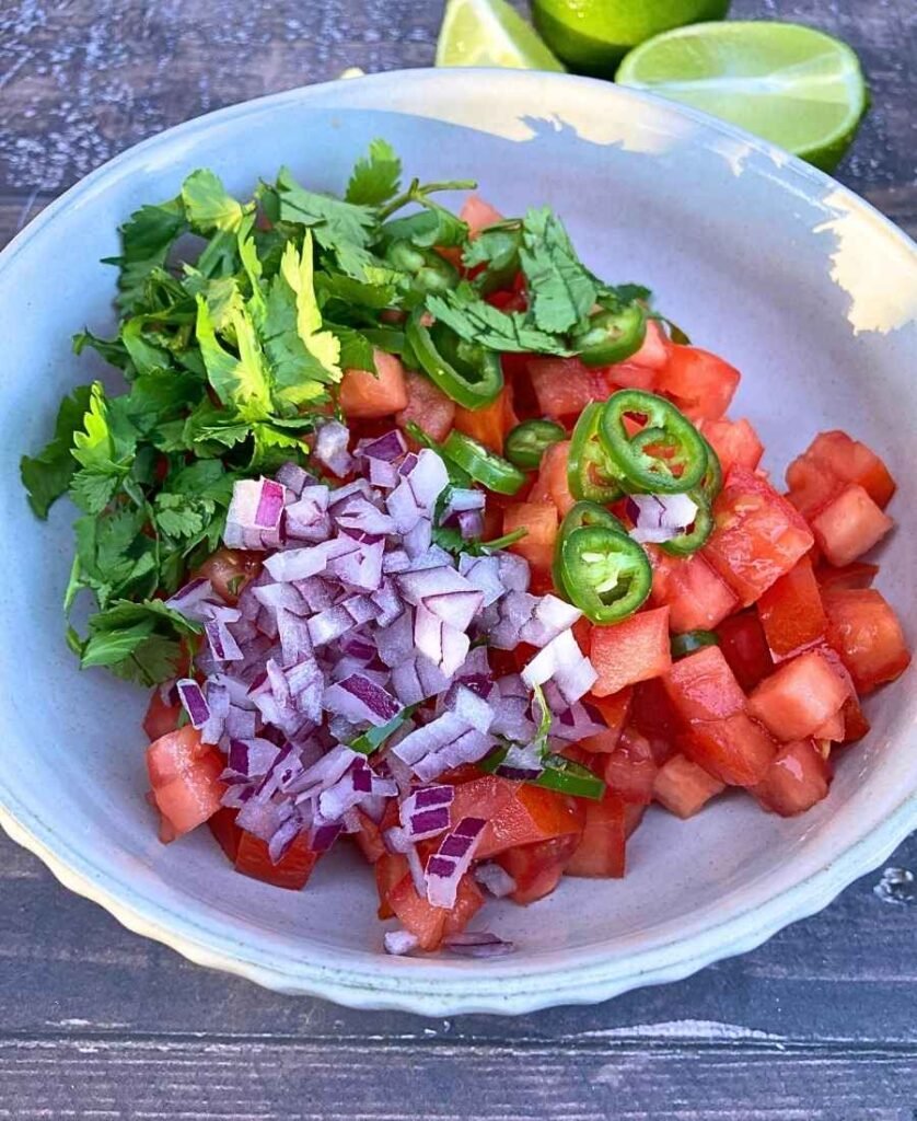 Fresh Pico De Gallo style salsa ingredients in a bowl