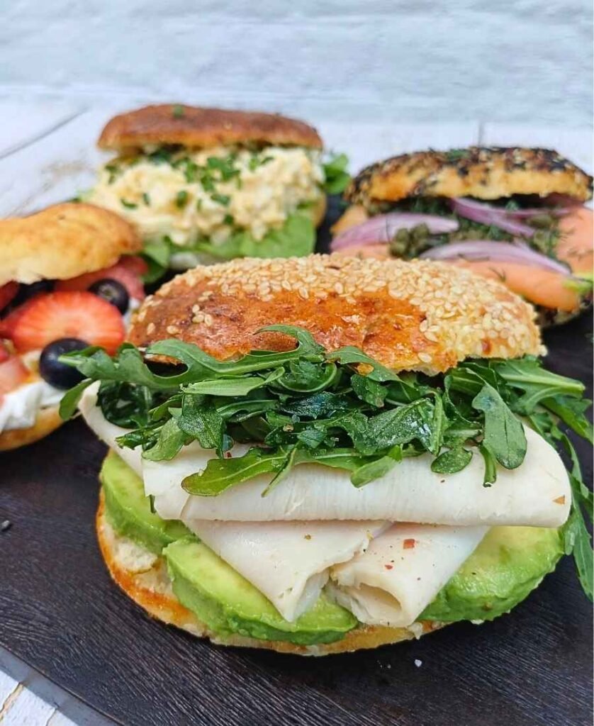 Cottage cheese bage filled with turkey, avocado and arugula