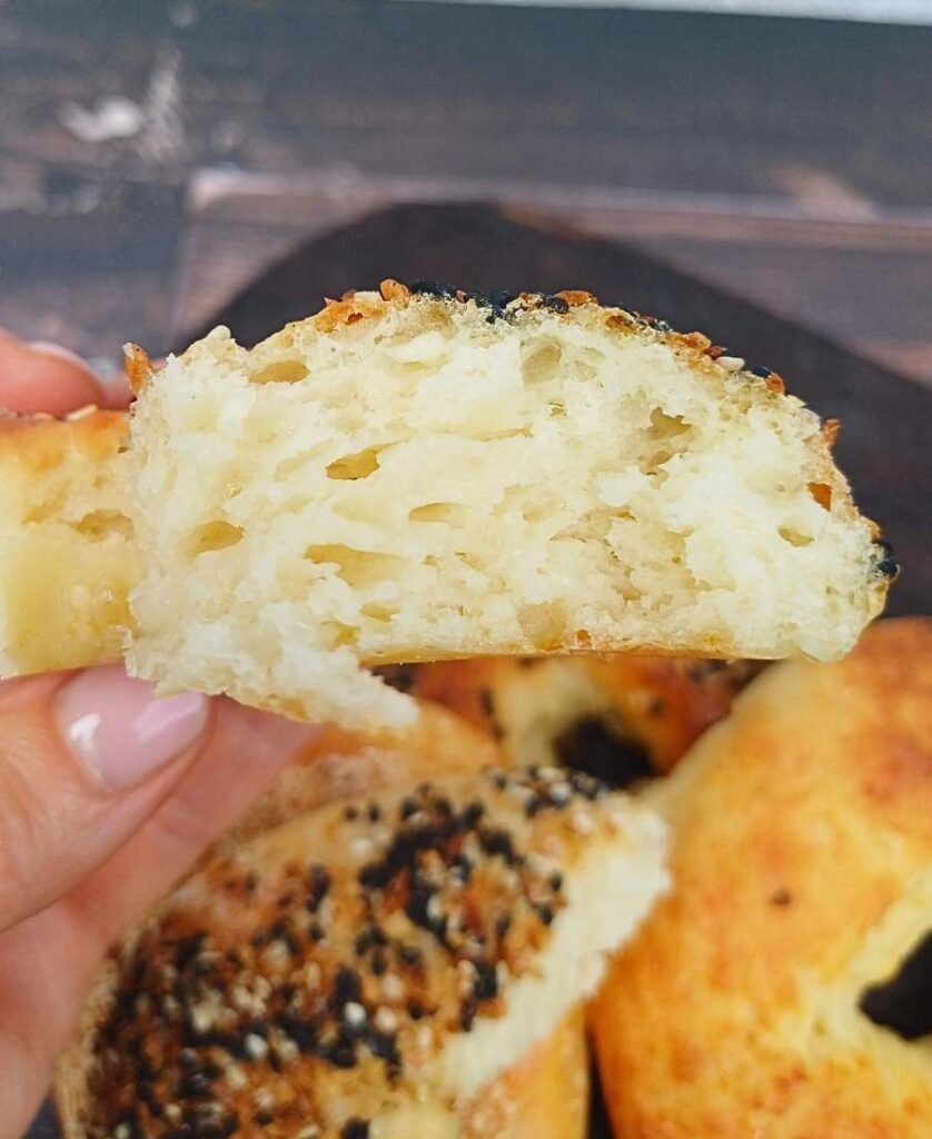 Close up of a soft bagel broken to show the inside